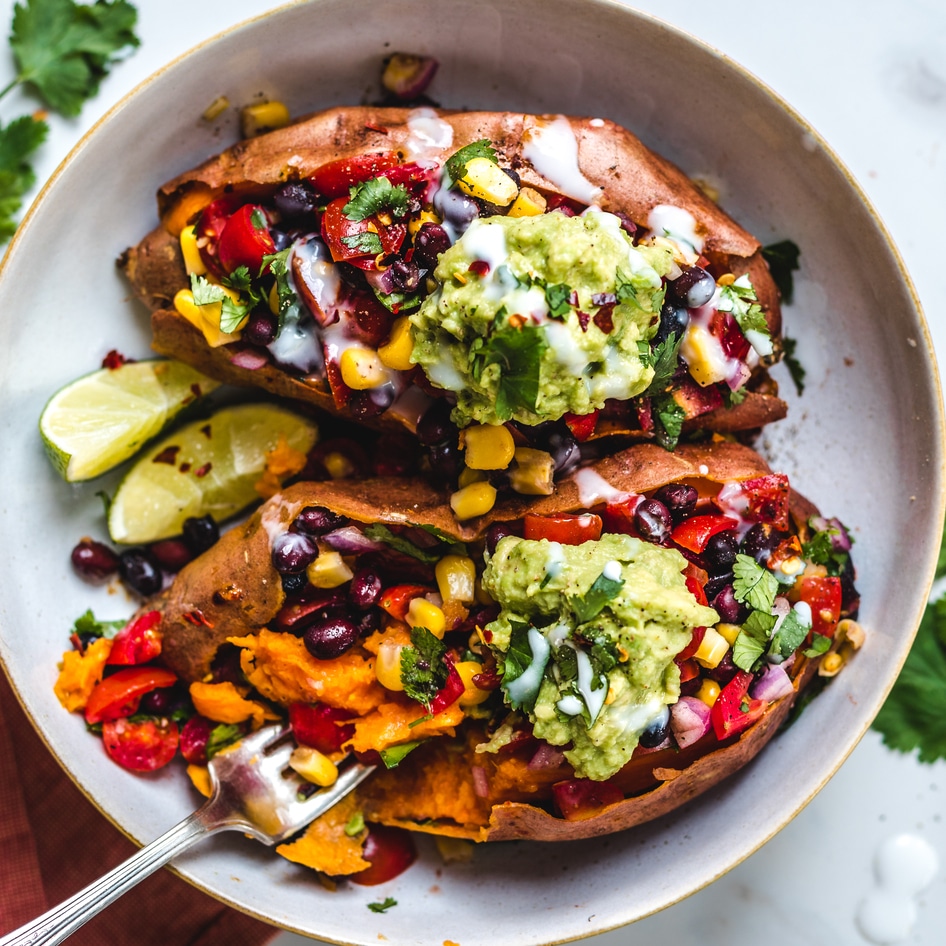 Black Bean-Stuffed Sweet Potatoes With Coconut Sour Cream and Guacamole
